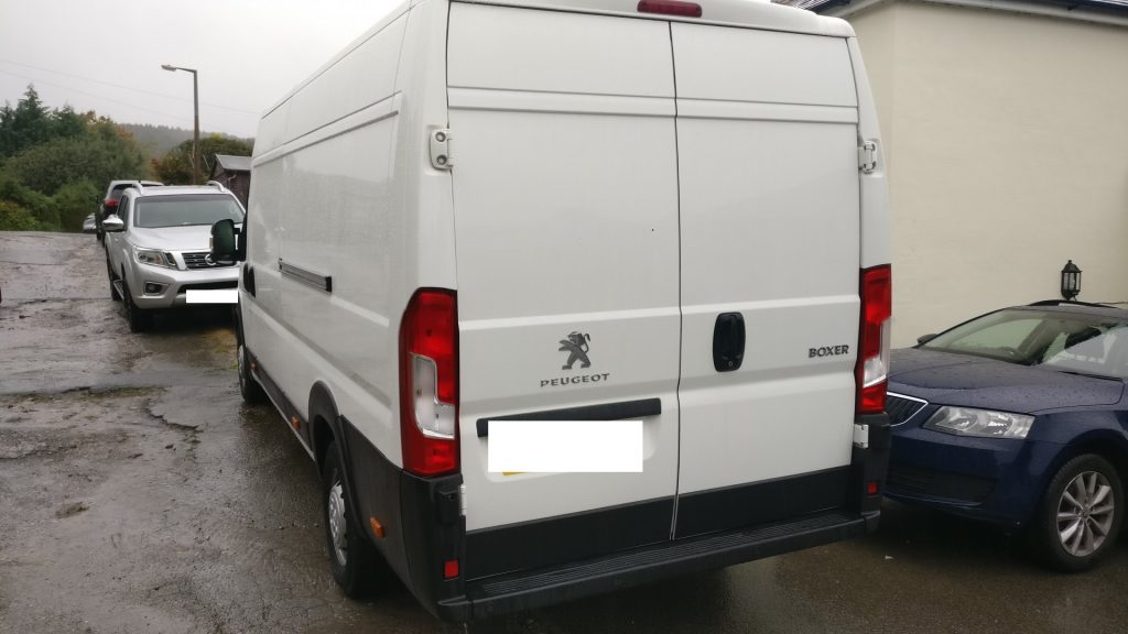 Our Peugeot Boxer van before we started conversion - a plain white long wheel base panel van.