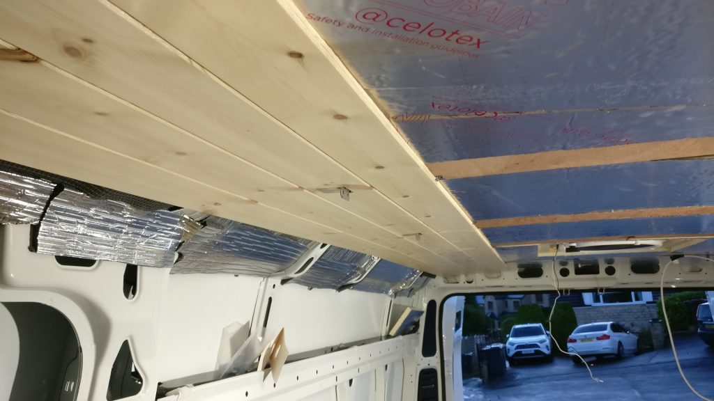 Pine cladding fitted to the ceiling, with celotex insulation also visible