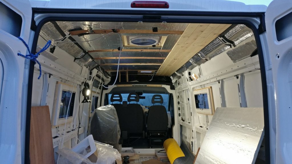 The van interior with partially fitted ceiling